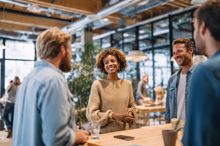 Diverse business team collaborating happily in modern office