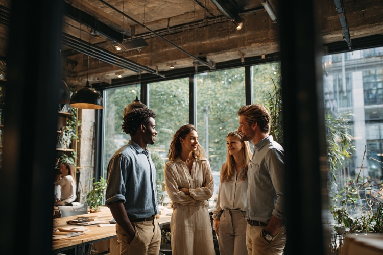 Diverse office team collaborating in modern coworking space