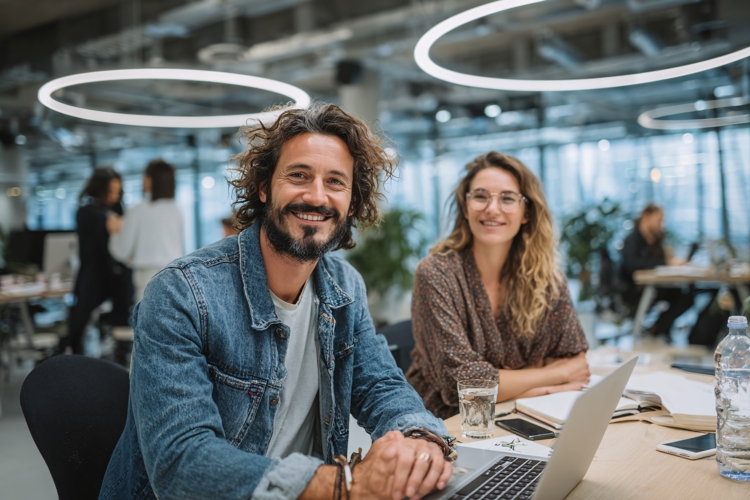 Smiling diverse business team working together in modern