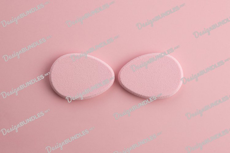 Cosmetic sponge in the shape of an egg on a pink background example image 1