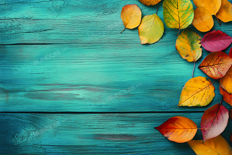 Autumn leaves on wooden background