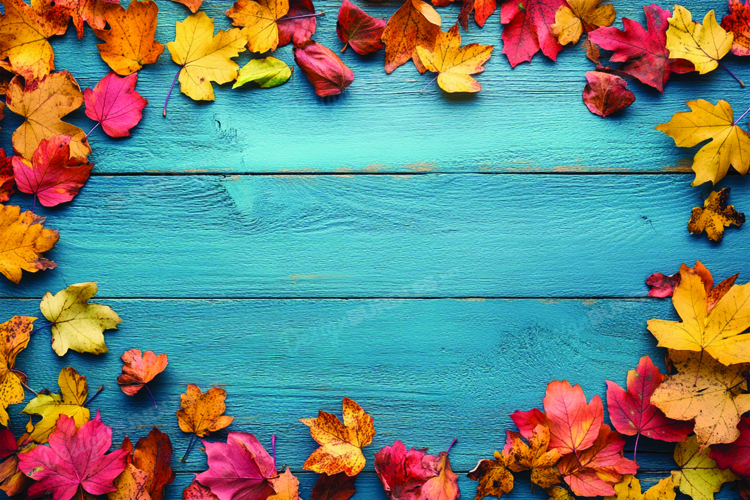 Autumn leaves on wooden background