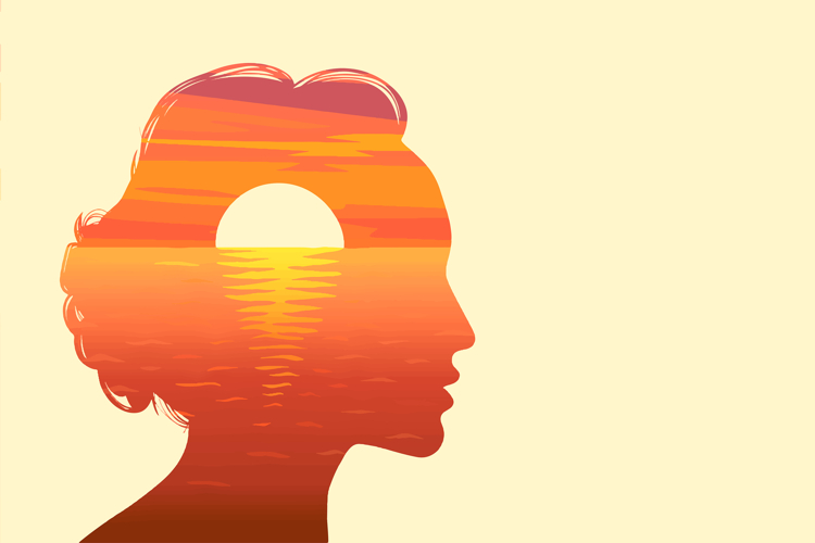 Sun rising over ocean in silhouette female head.