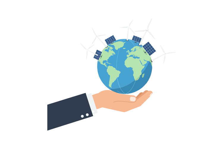 A hand holding a globe with solar panels and wind turbines i