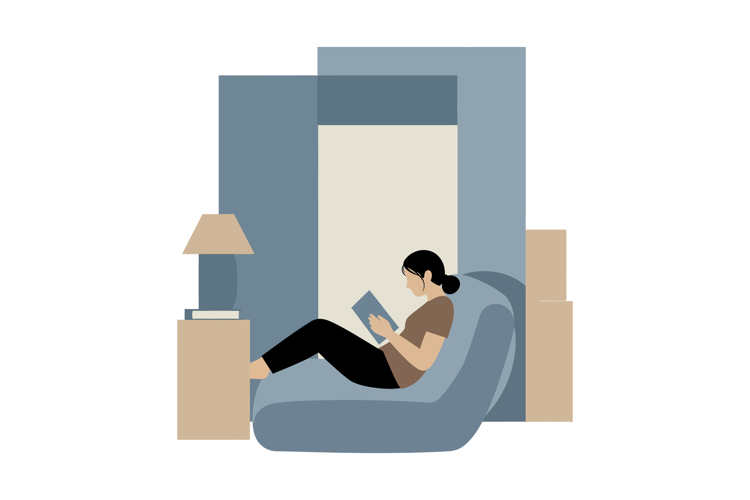Cozy indoor scene featuring a woman reading on a bean bag ch