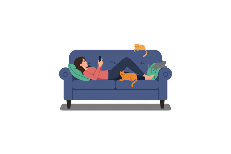 Person relaxing on a couch with multiple cats around them example image 1