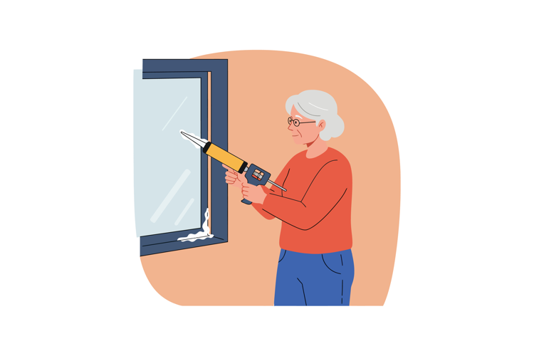 Elderly woman applying white sealant with caulking gun on wi