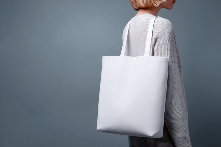 Woman Carrying White Canvas Tote example image 1