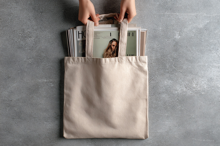 Beige Canvas Tote Bag with Magazines Inside