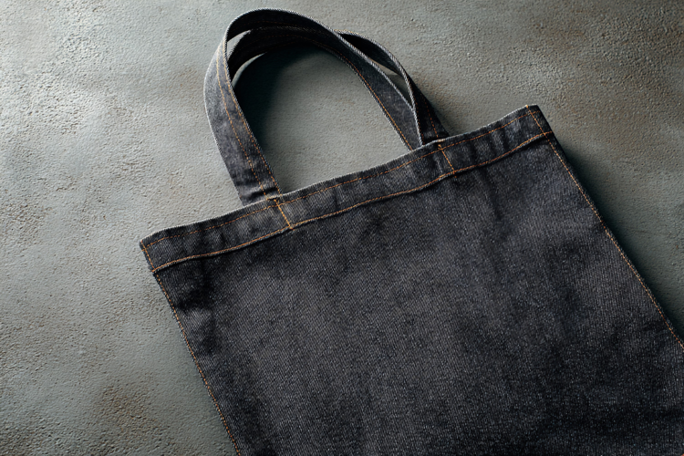 Black Denim Tote Bag on Concrete
