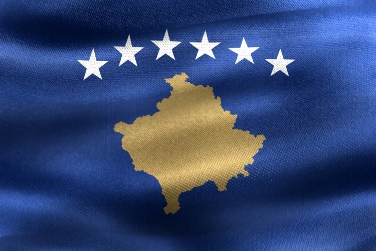 Kosovo flag - waving textile background