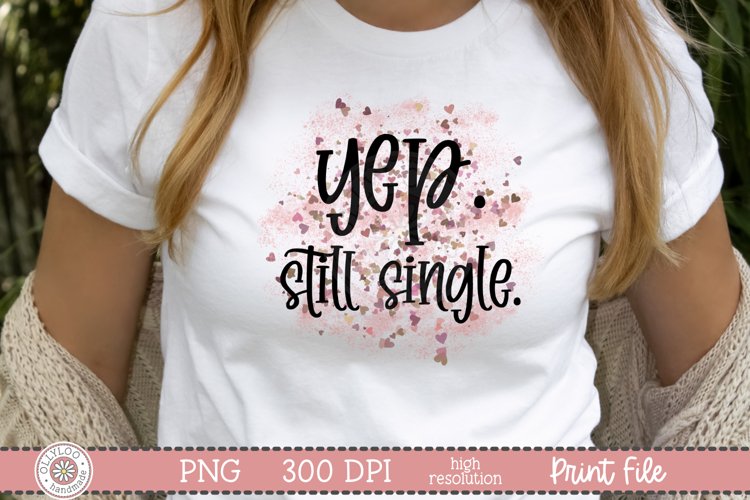 Yep Still Single quote with a pink and red confetti background on a white shirt mockup