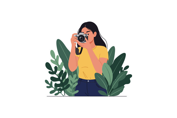 Young woman taking a photograph surrounded by lush green lea example image 1