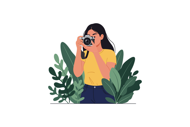 Young woman taking a photograph surrounded by lush green lea