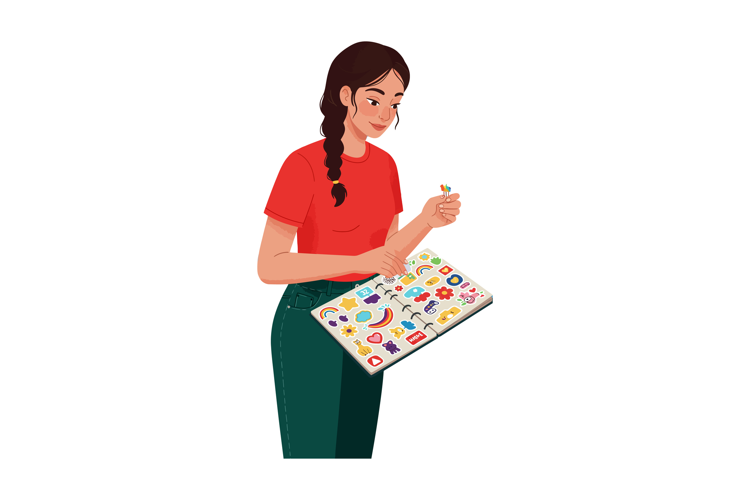 Young woman collecting colorful stickers in album enjoying h