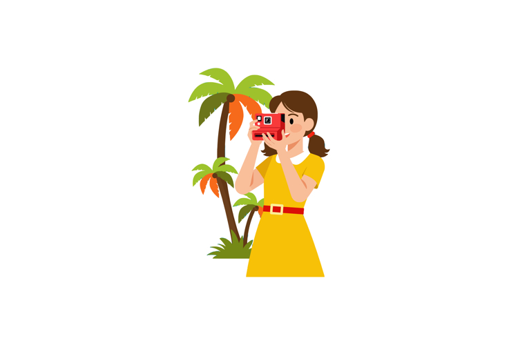 Woman in yellow dress taking photo with camera near palm tre