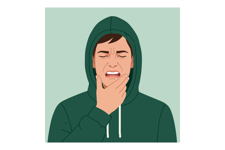 Young man in green hoodie holding chin with painful expressi